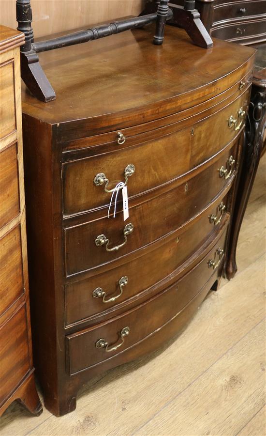 A reproduction four drawer bowfront chest with brushing slide W.76cm